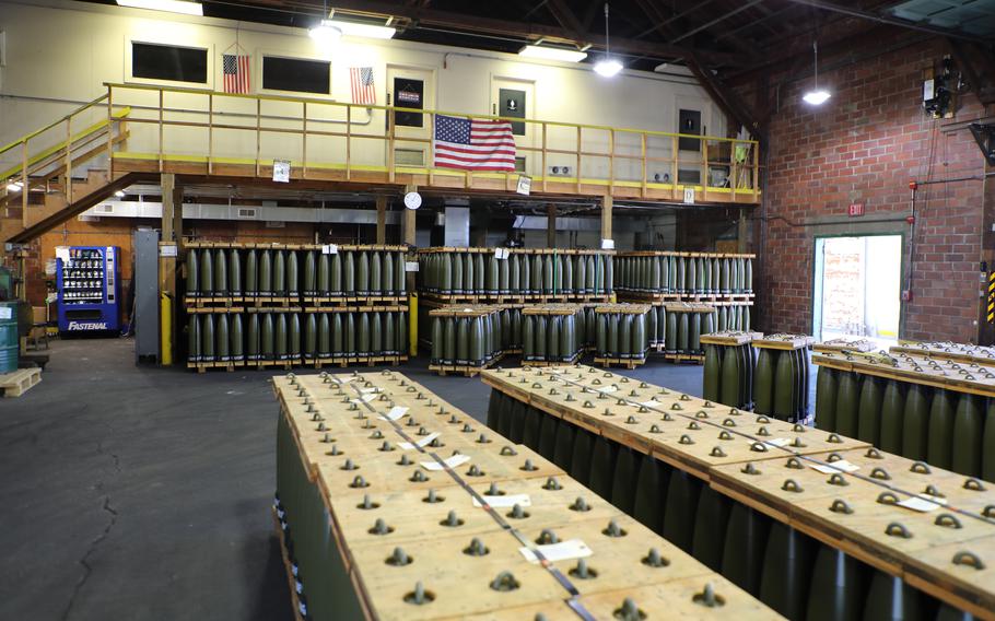 A large factory floor with boxes and crates.