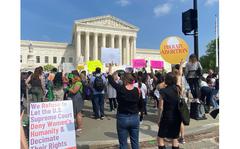 Protesters gather outside the Supreme Court on Tuesday, May 3, 2022, after a court draft opinion that would throw out the Roe v. Wade abortion rights ruling was leaked in a Politico article late Monday, May 2, 2022.