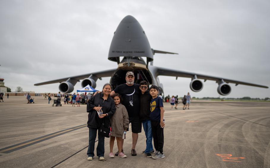 The Coronado family of San Antonio pose for a photo in front of a static C-5 Galaxy, Saturday, April 6, 2024, at Joint Base San Antonio-Randolph, Texas. 