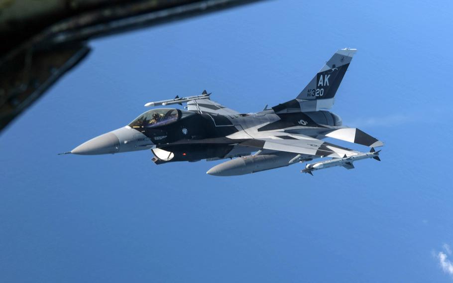 An  F-16 Fighting Falcon from Eielson Air Force Base, Alaska, flies over the Philippine Sea for aerial refueling during the Cope North exercise, Feb. 16, 2021.