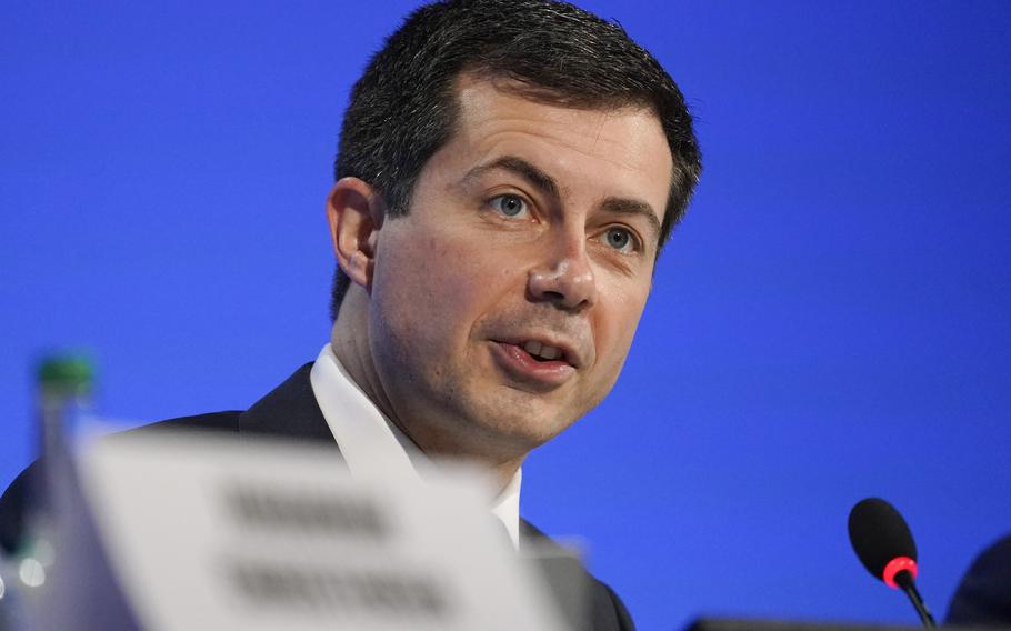 Secretary of Transportation Pete Buttigieg speaks at the COP26 U.N. Climate Summit, in Glasgow, Scotland, Nov. 10, 2021. Buttigieg has pledged to make racial equity a top priority. His department is reviewing civil rights and environmental justice concerns raised about a $9 billion highway widening project being proposed in the Houston area.