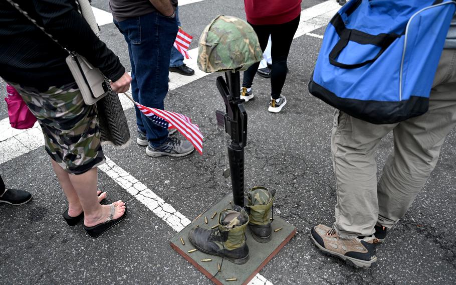 People gather near the tribute to the fallen after the Rolling to Remember demonstration in May 2021 in Washington. 