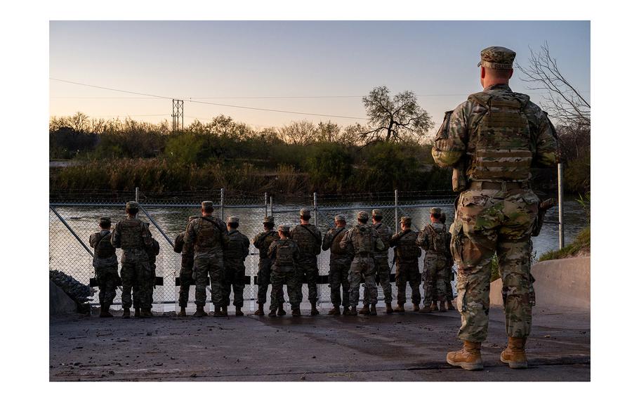 National Guard soldiers stand guard on the banks of the Rio Grande river at Shelby Park on Jan. 12, 2024, in Eagle Pass, Texas. The Texas National Guard continues its blockade and surveillance of Shelby Park in an effort to deter illegal immigration. The Department of Justice has accused the Texas National Guard of blocking Border Patrol agents from carrying out their duties along the river. 