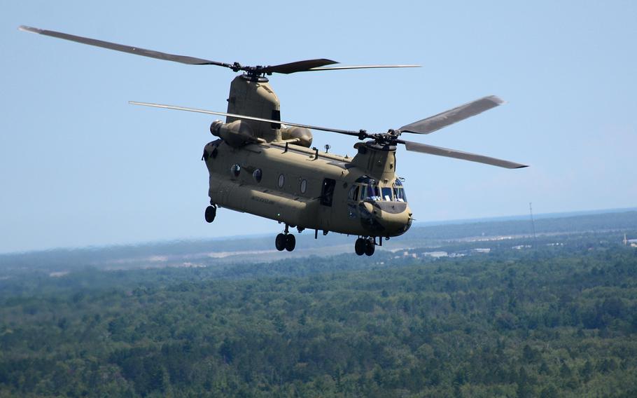 A CH-47 Chinook helicopter from 2nd General Support Aviation Battalion, 135th Aviation Regiment, Colorado Army National Guard, conducts a movement from the Combat Readiness Training Center in Alpena, Mich. to Camp Grayling Aug. 10, 2018, during Northern Strike 18.