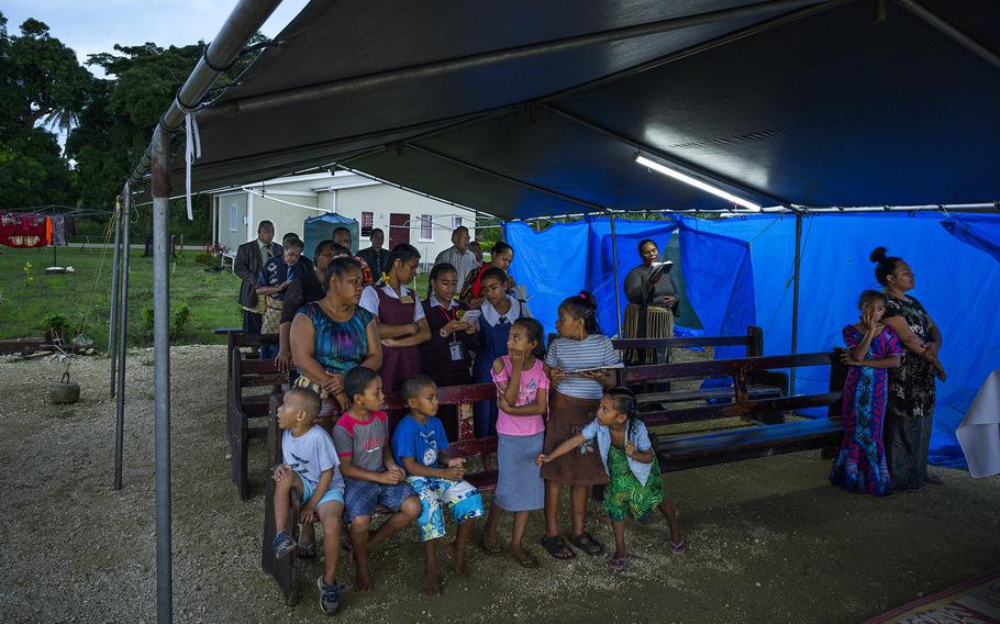 Displaced by the tsunami, former residents of Atata gather for a church service. 
