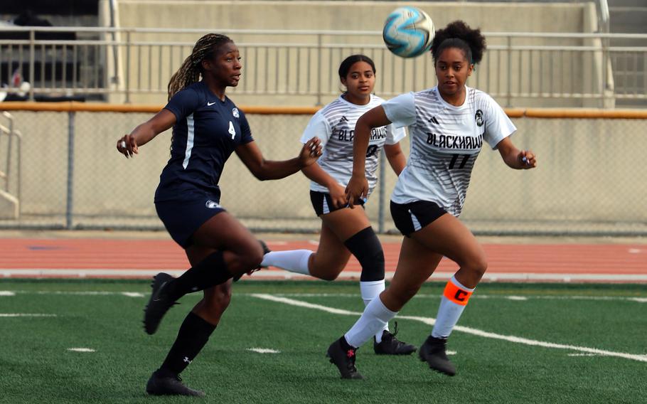 Osan’s Tatiana Lunn and Humphreys’ Callie Green and Christine Sanchez chase the ball during Monday’s quarterfinal in the Korea postseason girls soccer tournament. The Blackhawks won 8-5, then later lost the semifinal to Chadwick International 6-2. Osan is still alive for fifth place and Humphreys will play Saturday for third.