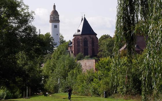 A view of St. Justin's Church and the tower of the Hoechst Palace from a path that runs along the Main River. Hoechst is a borough of Frankfurt located a couple of miles downstream from the city center.