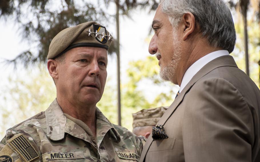 Gen. Scott Miller, left, speaks with Abdullah Abdullah, the head of the Afghanistans High Council for National Reconciliation, on July 12, 2021. The two were speaking at a ceremony at which Miller relinquished command of United States Forces-Afghanistan and NATOs Resolute Support mission. 