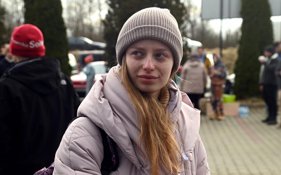 Maria Heckard, 20, talks about fleeing Kyiv, Ukraine, then leaving the country with her family, at a transit site for refugees near the border crossing at Korczowa, Poland, Feb. 27, 2022.