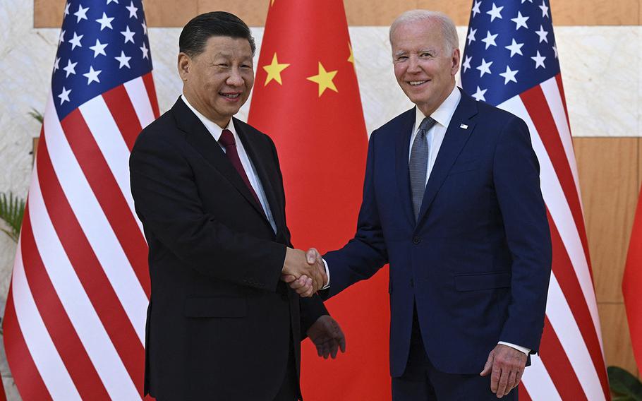 US President Joe Biden and China’s President Xi Jinping shake hands as they meet on the sidelines of the G20 Summit in Nusa Dua on the Indonesian resort island of Bali on Nov. 14, 2022. 