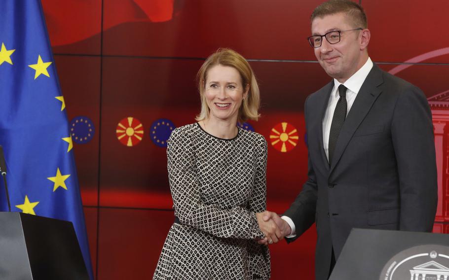 European Union foreign policy chief Kaja Kallas, left, shakes hands with North Macedonia’s Prime Minister Hristijan Mickoski.