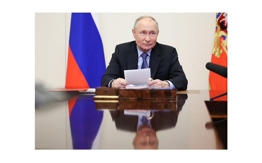 Russia's President Vladimir Putin chairs a Russian Security Council meeting via a video linkup from Novo-Ogaryovo residence, on Feb. 13, 2024, in Moscow. 