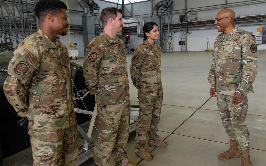 Air Force Chief of Staff Gen. Charles Q. Brown Jr., right, talks to 1st Lt. Miolani Grenier, Tech. Sgt. Eric Dafforn and Senior Airman Jordan Bybee during his visit to Ramstein Air Base, Germany, July 15, 2021. 