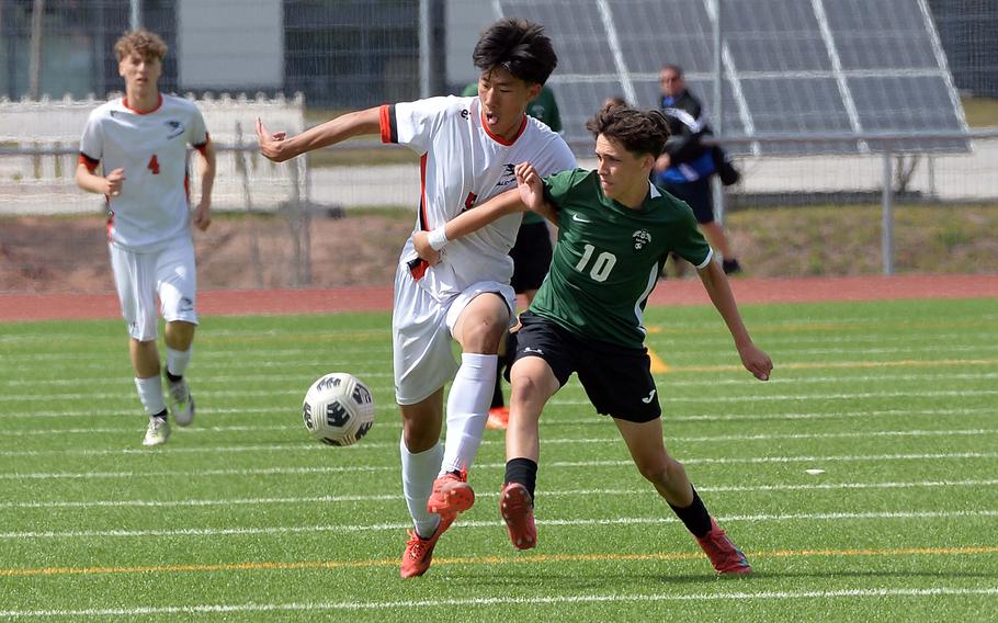 Finn Stephens of Naples, right defends against American Overseas School of Rome’s MengPeng Jiang in the boys Division II final at the DODEA-Europe soccer championships in Ramstein, Germany, May 22, 2025. Naples took the title with a 5-2 win.