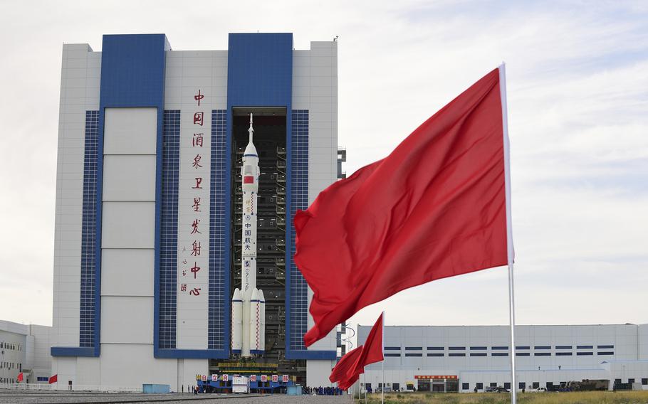 The Shenzhou-12 manned spaceship with its Long March-2F carrier rocket is being transferred to the launching area of Jiuquan Satellite Launch Center in northwestern China's Gansu province, on Wednesday, June 9, 2021.