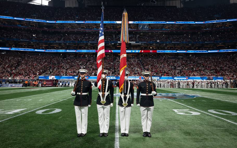 Marine Corps Color Guard presents the colors.