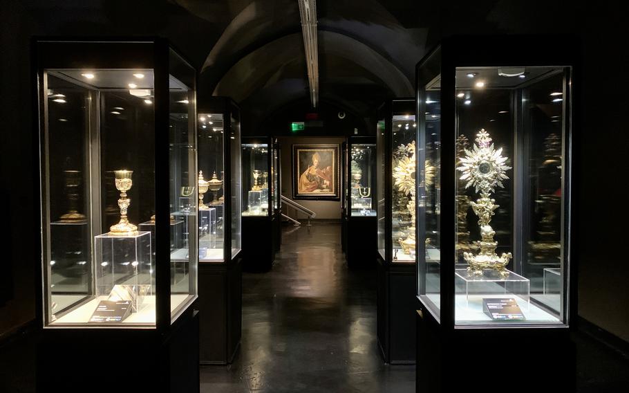 Religious objects including chalices and jewelry are displayed along with sculptures and paintings at the Museum of the Treasure of San Gennaro in Naples, Italy. 