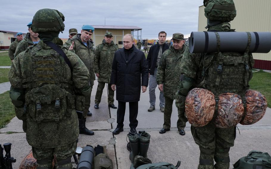 Russian President Vladimir Putin, center, visits troops in the Ryazan region south of Moscow, Oct. 20, 2022. Putin's top general is concerned about his troops being clean shaven, according to the British Defense Ministry and sources inside Russia.