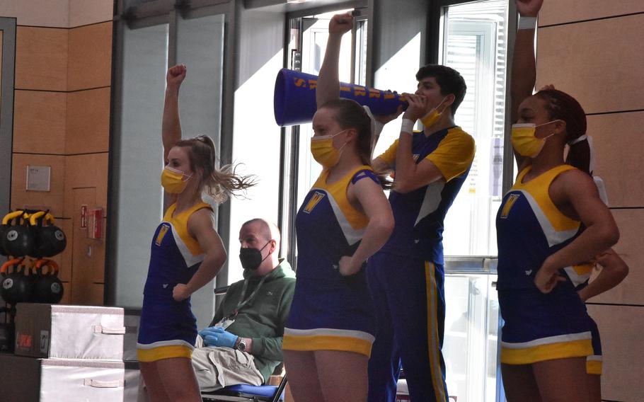 Members of the Wiesbaden cheerleading squad try to rally their team and its supporters Saturday, Feb. 26, 2022 at the DODEA-Europe Division I basketball  championships. Wiesbaden took the D-I cheerleading championships earlier in the day.