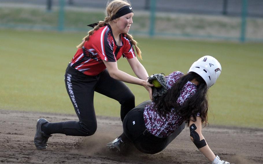 Matthew C. Perry's Chelsea Campbell slides safely into second base ahead of the tag of E.J. King shortstop Alyssa Chaney during Friday's DODEA-Japan softball game. The Samurai won 10-6 and later tied Canadian Academy 3-3.