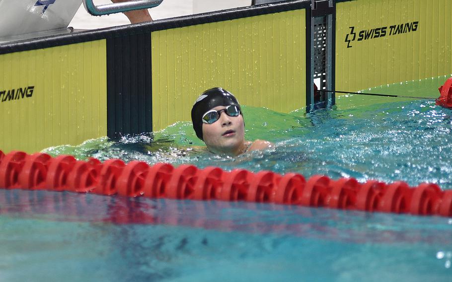 Brunssum Orca Benthe de Beer looks up at the scoreboard after winning the 10-year-old girls 100-meter freestyle during the European Forces Swim League Short-Distance Championships on Feb. 11, 2024, at the Pieter van den Hoogenband Zwemstadion at the Nationaal Zwemcentrum de Tongelreep in Eindhoven, Netherlands.