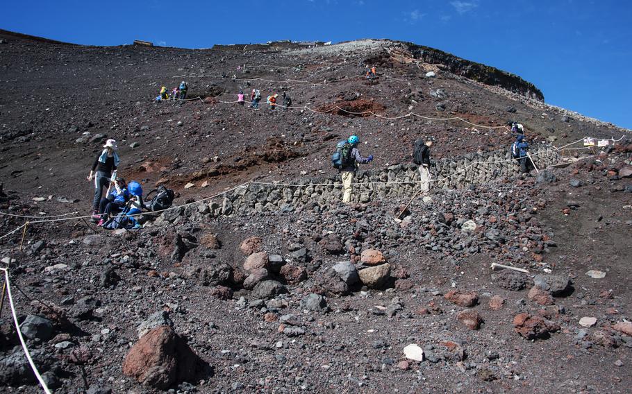 Climbing Mount Fuji, elevation 12,388 feet, can take five to seven hours; descending can take three to four hours depending on which trail the hiker chooses, according to the official Mount Fuji Climbing website. 