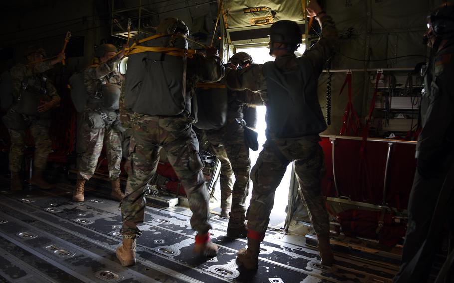 U.S. Army paratroopers from Stuttgart, Germany, prepare to jump out of a C-130J Super Hercules during a training flight May 25, 2022, over Ramstein Air Base, Germany.