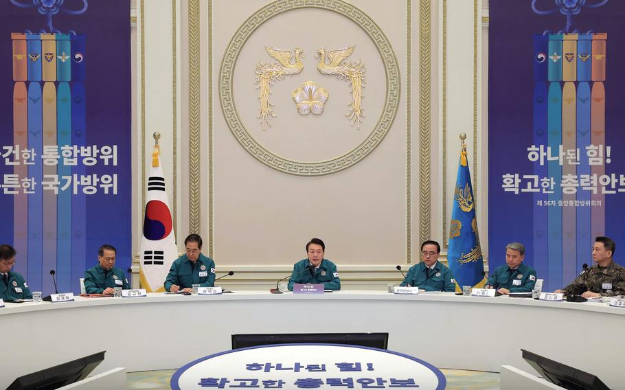 South Korean President Yoon Suk Yeol leads a meeting with senior officials during the annual Central Integrated Defense Council forum in Seoul, Wednesday, Feb. 8, 2023. 