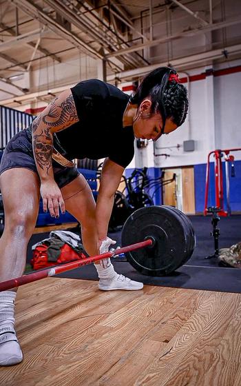 Senior Airman Bianca Mendoza, 377th Security Forces defender, prepares to deadlift at Kirtland Air Force Base, N.M., Dec. 15, 2023.