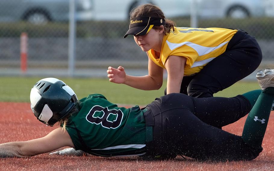 Kadena shortstop MyLein Tull tags out Kubasaki baserunner Kristin Lininger at second base.