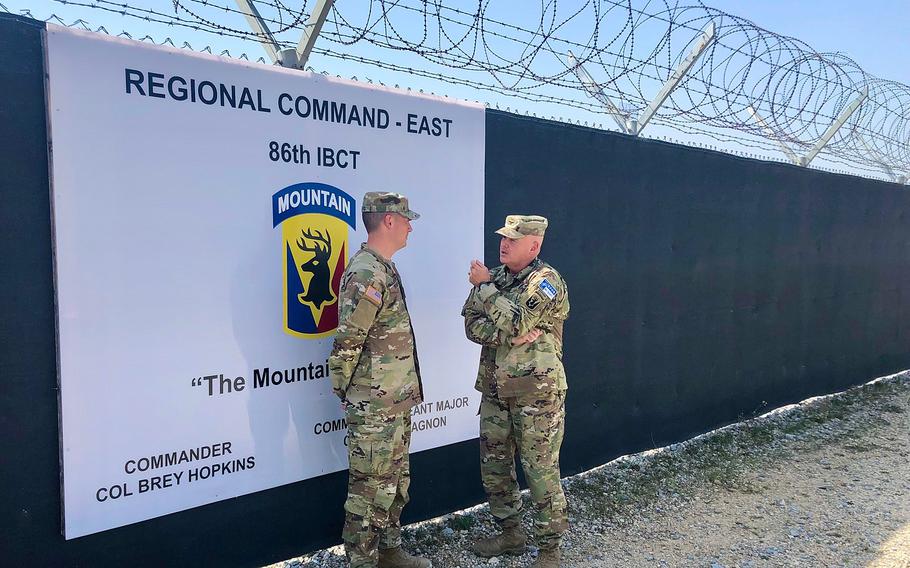 Col. Brey Hopkins, right, talks to Capt. Jeffrey Jace Rivard of the Vermont Army National Guard at Camp Bondsteel in Kosovo. The U.S.-led NATO force has helped keep the peace between rival Albanians and Serbs in Europes youngest nation since a brief war in 1999.