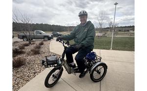 Ed McLaughlin, 96, on his e-tricycle, which he rides every day for about 7 miles. MUST CREDIT: Good Samaritan Society-St. Martin Village