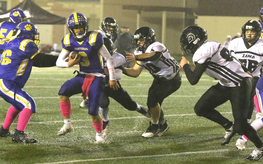 Yokota's Dylan Tomas gets hounded in the backfield by pursuing Zama defenders.