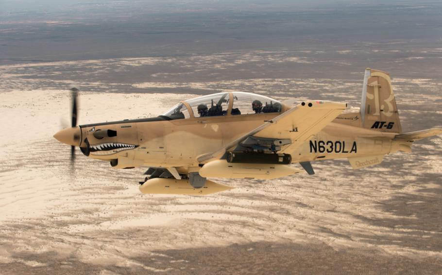 A Beechcraft AT-6 experimental aircraft flies over White Sands Missile Range in July 2017. The AT-6  is one of five prototypes U.S. Special Operations Command has selected to demonstrate for its Armed Overwatch program.

 Ethan D. Wagner/U.S. Air Force