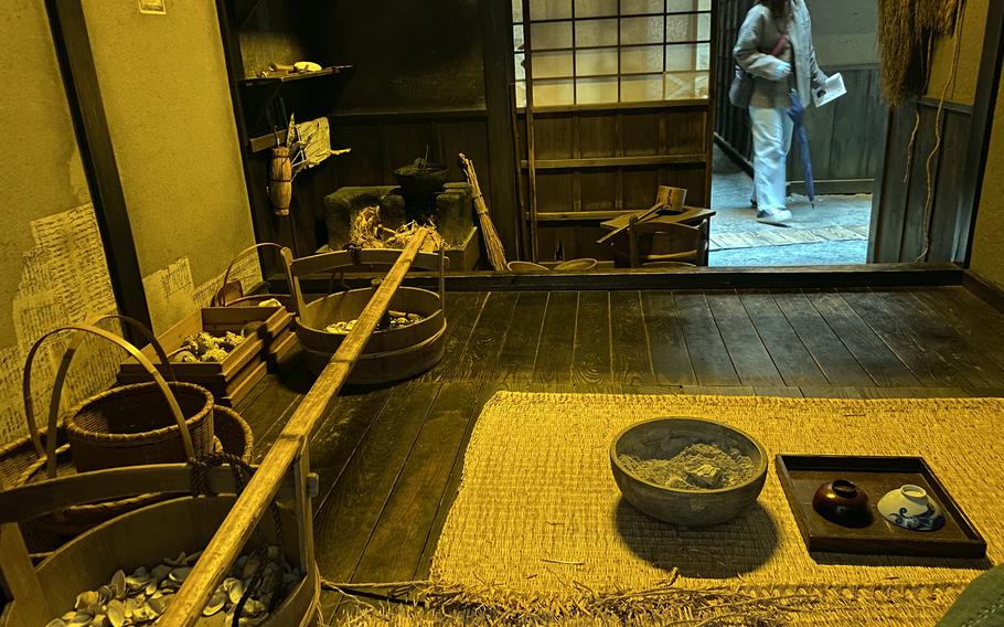 A visitor explores the Fukagawa Edo Museum, which reproduces the Tokyo town of Fukagawa-Saga during the late Edo period.