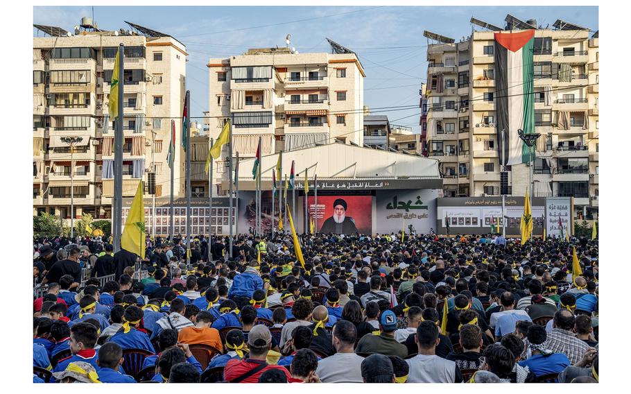 Supporters watch the broadcast of Hezbollah chief Hassan Nasrallah’s speech in Dahieh district, Beirut, on Nov. 3, 2023.