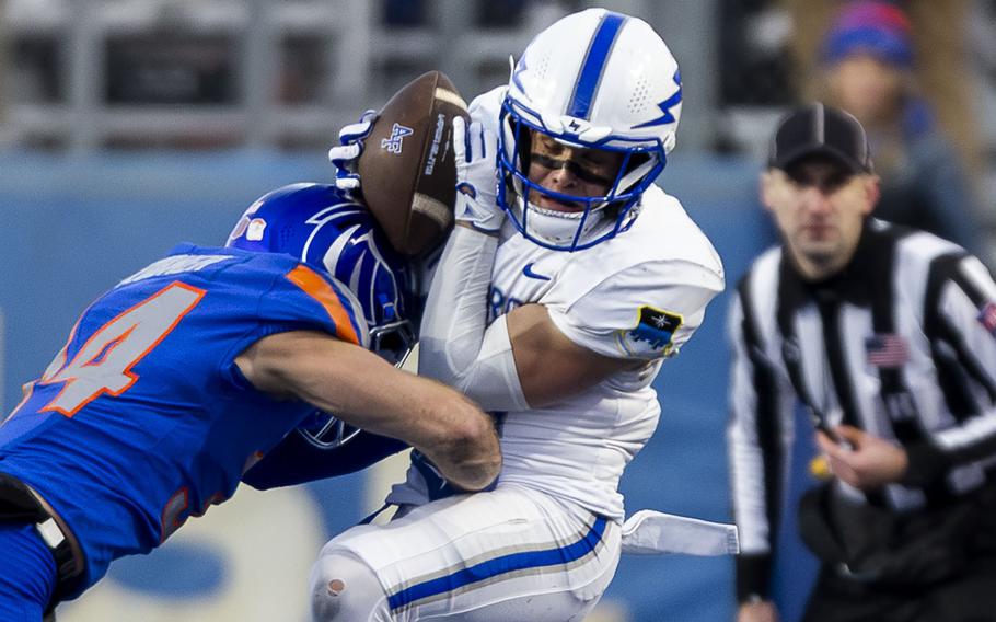 Air Force wide receiver Cade Harris, right, hauls in a pass against Boise State safety Alexander Teubner during the fourth quarter on Nov. 24.