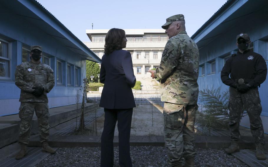 U.S. Vice President Kamala Harris, center left, stands next to the demarcation line at the demilitarized zone separating the two Koreas, in Panmunjom, South Korea Thursday, Sept. 29, 2022. 