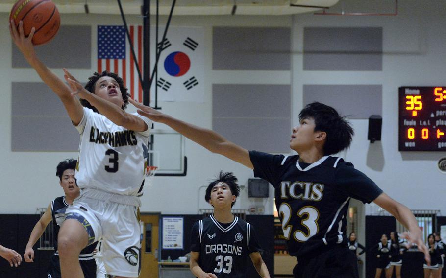 Humphreys' Brandon Howell skies to shoot against Taejon Christian during Wednesday's Korea boys basketball game. The Blackhawks won 93-70.