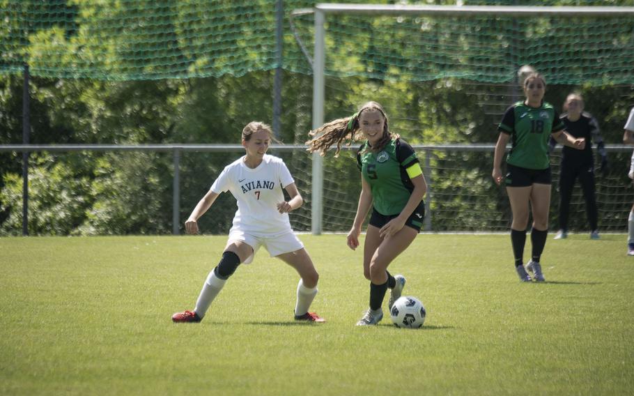 Emma Heavey, a junior with the Naples Wildcats, goes up against Aviano senior Irina Poulter during the Division II DODEA European Championships at Reichenbach-Steegen, Germany on May 20, 2025.