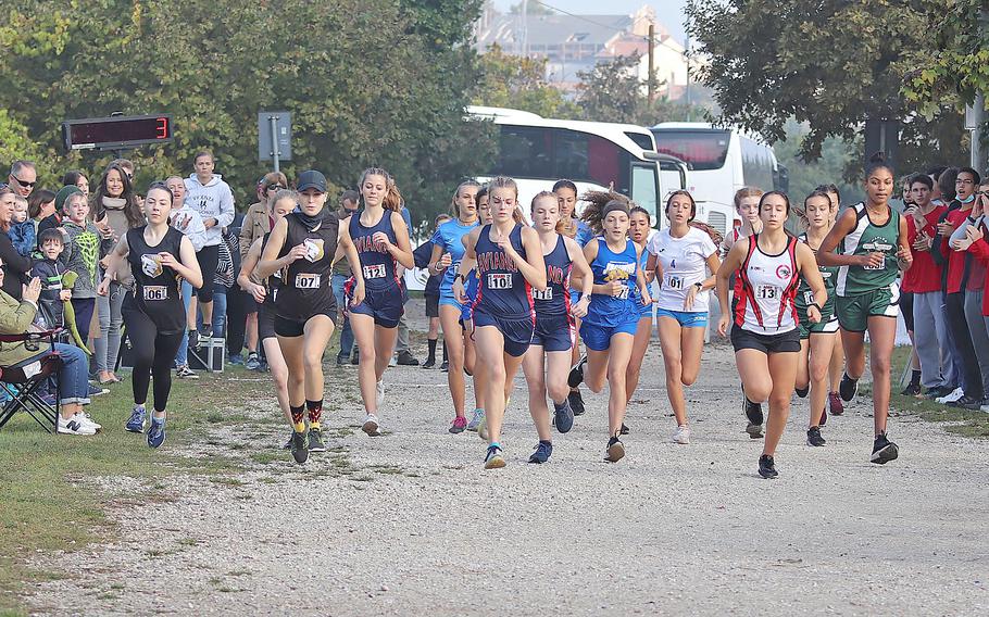 Runners start off the girls race at Lago di Fimon, Italy, during the DODEA South cross country championships on Saturday, Oct. 23, 2021.