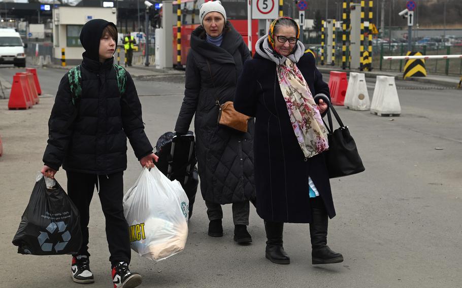 Refugees from Ukraine cross the border into Poland at Medyka, March 2, 2022. More than 1 million people have fled Ukraine since Russia’s full-scale invasion last week, according to the United Nations.