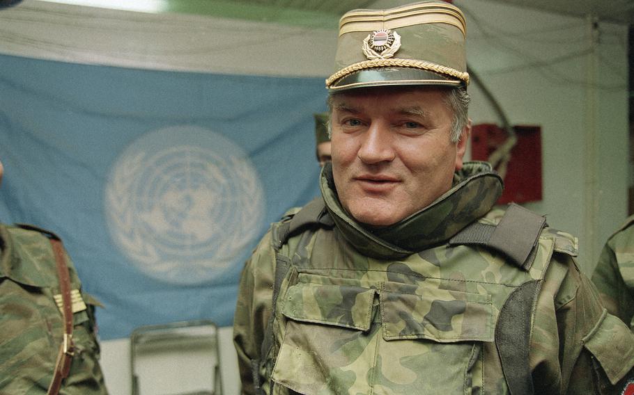 Bosnian Serb commander Gen. Ratko Mladic is pictured near a United Nations flag at Sarajevo Airport on May 17, 1993.