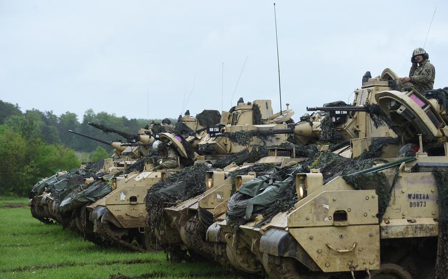 Soldiers from 2nd Brigade, 1st Cavalry Division’s Troop D assemble their Bradley Fighting Vehicles as part of Exercise Combined Resolve 18 on May 21, 2023 at the Joint Multinational Readiness Center in Hohenfels, Germany.