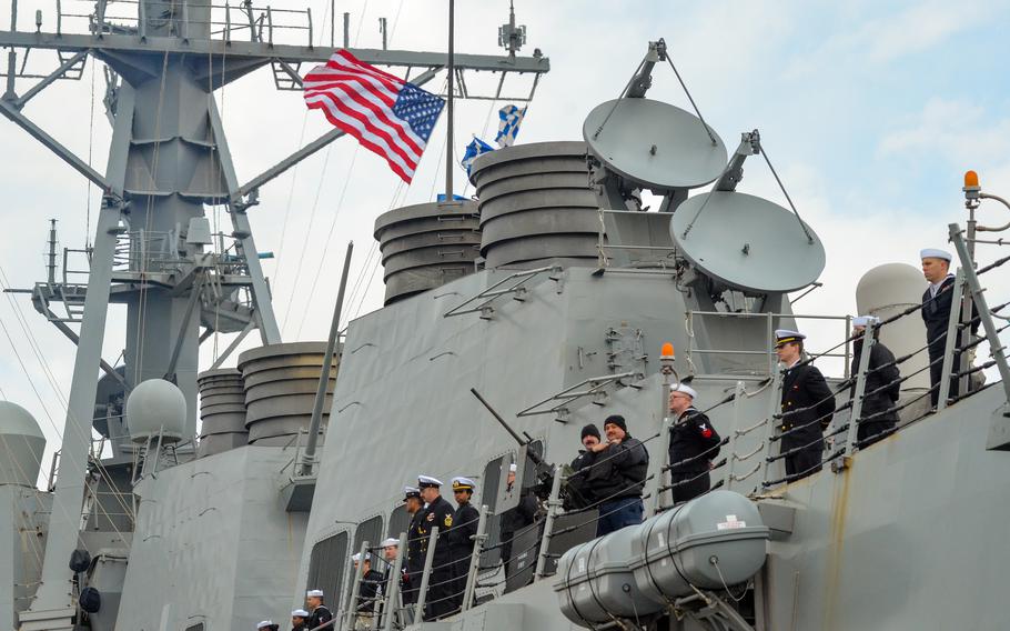 Sailors man the rails as the guided-missile destroyer USS McCampbell returns to Yokosuka Naval Base, Japan, on March 2, 2024.