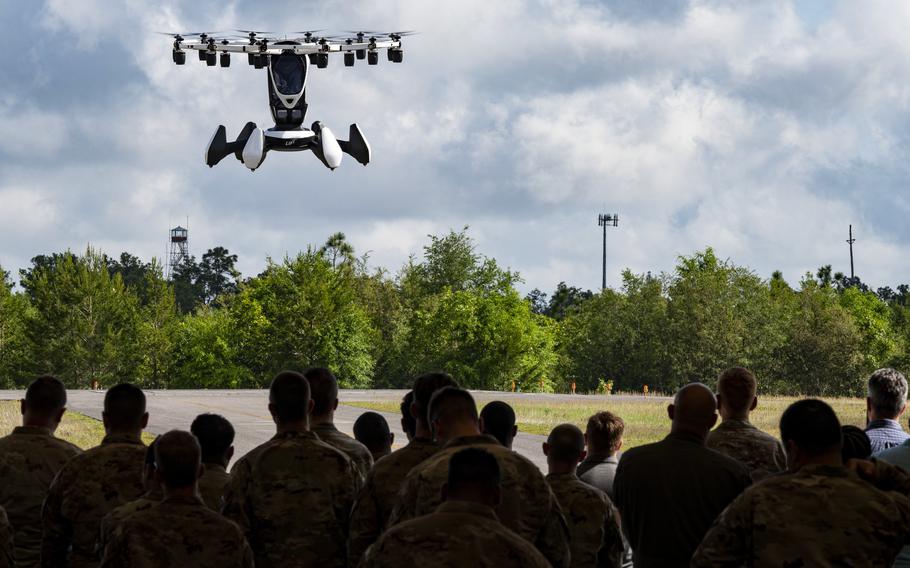 Lift Aircraft’s Hexa aircraft, an Air Force Agility Prime project vehicle, demonstrates its abilities to U.S. airmen and civilian staffers at Hurlburt Field, Fla., May 3, 2022. Lawmakers are pushing for the rapid adoption of electric and hybrid aviation technologies in the military, aiming to enhance efficiency and reduce the carbon footprint of defense operations.