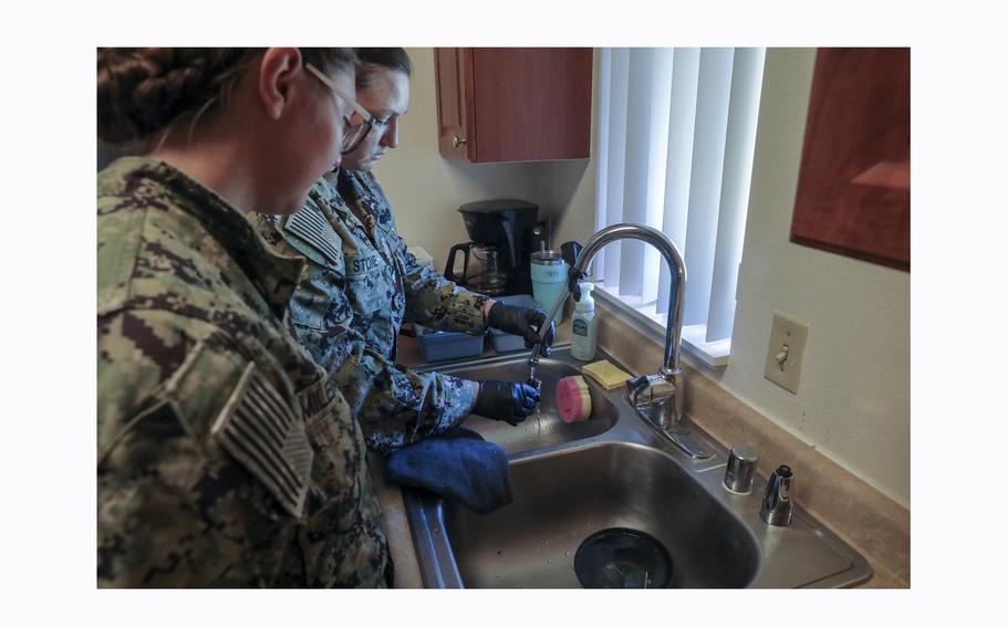 Members of the Navy’s Rapid Response Team test tap water at an Aliamanu Military Reservation home in Honolulu on March 21, 2024. 