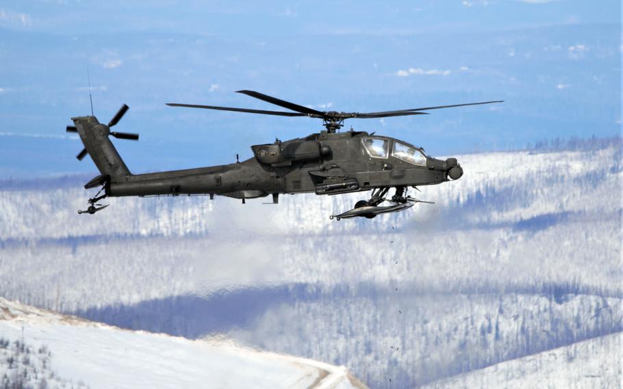 An AH-64 Apache fires at a target in the Yukon Training Area, adjacent to Fort Wainwright, Alaska, April 13, 2021. 