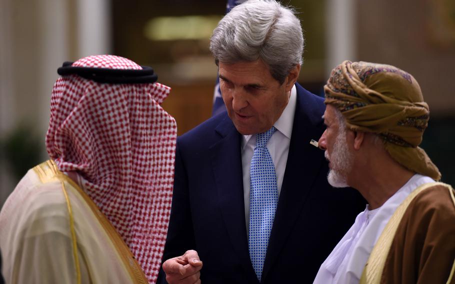 In this photo from Dec. 18, 2016, then U.S. Secretary of State John Kerry, center, talks to Omani Minister of Foreign Affairs Yusuf bin Alawi bin Abdullah and Saudi Minister of Foreign Affairs Adel al-Jubeir, left, during a meeting in Riyadh, Saudi Arabia.