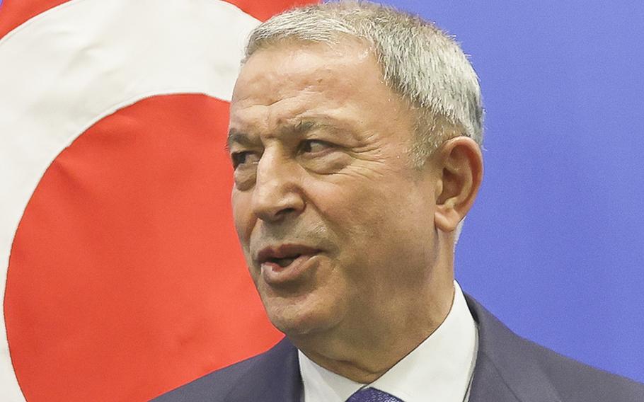 Turkish Defense Minister Hulusi Akar arrives for a meeting at NATO headquarters in Brussels on March 16, 2022. 
